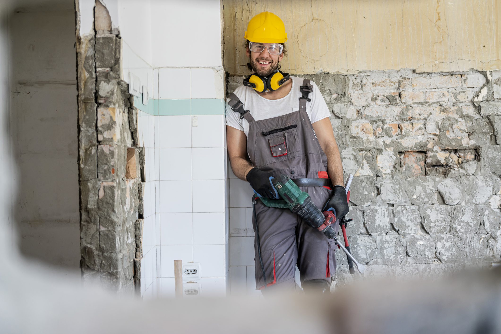 Man in hard hat holding power tool