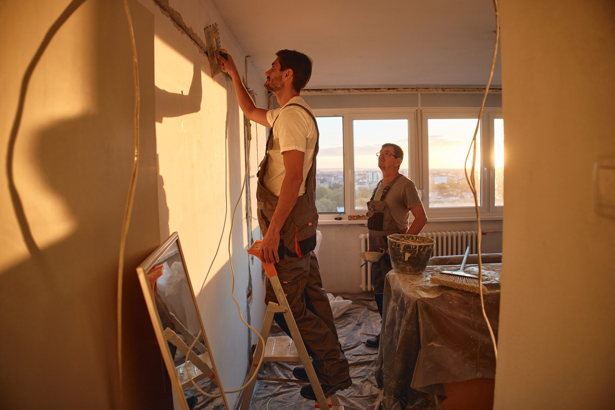 People renovating a room